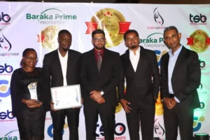 Precision Automotive CEO Imran Sokwala (center) with his team at the Topsin Brands awards in Nairobi on Monday.