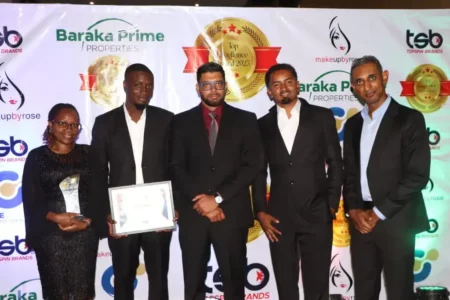 Businesses Advocate Prompt Government Bill Payments to Revitalize Economy Precision Automotive CEO Imran Sokwala (center) with his team at the Topsin Brands awards in Nairobi on Monday.