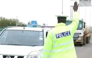 Police Initiate Major Strategy To Prevent Nairobi-Nakuru Christmas Gridlock A police officer controlling vehicles along the Nairobi Nakuru highway
