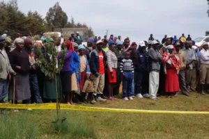 Residents of Gitithia location watch in disbelief the dead body of a man who' was found dead at the roadside.
